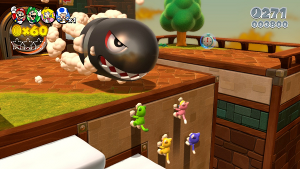 Mario und seine Freunde klettern eine Wand hinauf, über ihnen fliegt ein Kugelwilli.