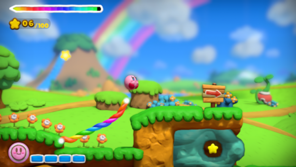 Screenshot: Kirby gleitet an der Regenbogenschnur (buntes Seil) entlang