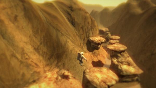 Der Astronaut springt von einem Felsen auf einen anderen, die Landschaft ist karg und steinig.