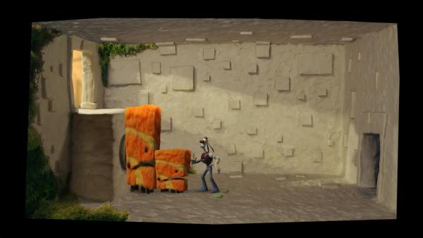 Screenshot: "Tommynaut" steht vor zwei behaarten, fiktiven Tieren in einem karg ausgestattetem Raum