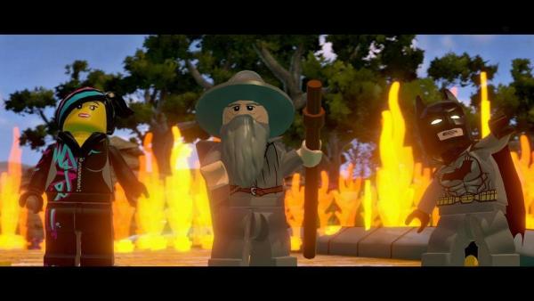 Screenshot: Wyldstyle, Gandalf und Batman vor einer Feuerwand